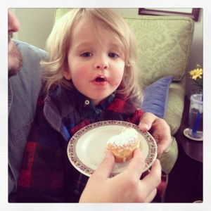 a gratuitous photo of my nephew, who also recently turned two, eating his first sufganiyah; photo by salem pearce via instagram