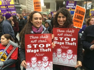 emily and helen, with signs from interfath worker justice, at "fight for 15" rally in downtown boston; photo by salem pearce